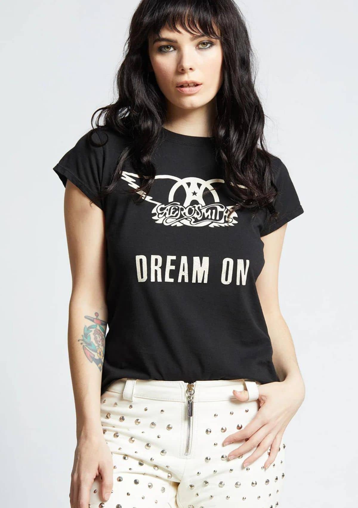 Black with off white lettering. Paired with white jeans.