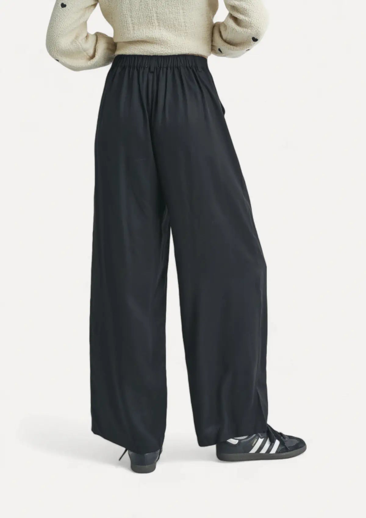 Paired with white sweater and black sneakers.