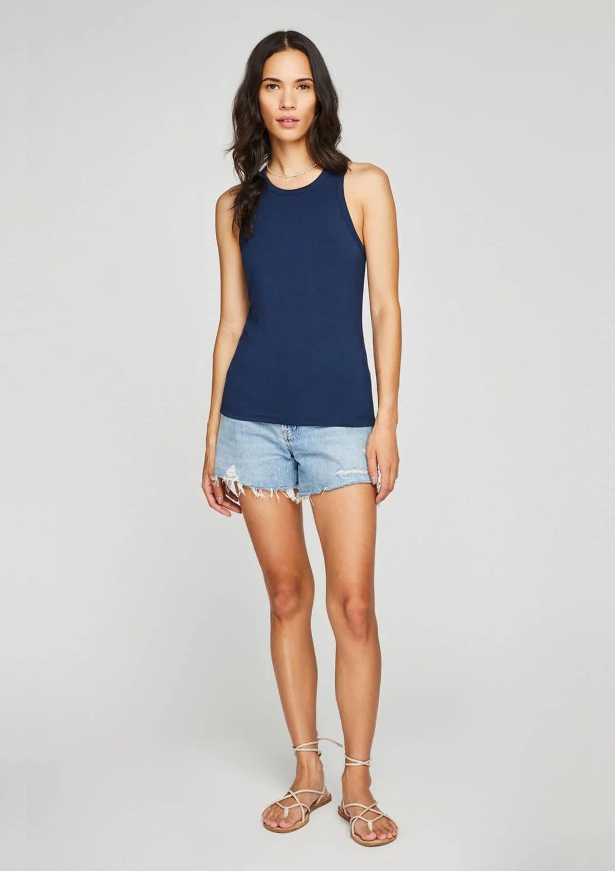Navy racerback. Paired with jean shorts and white sandals.