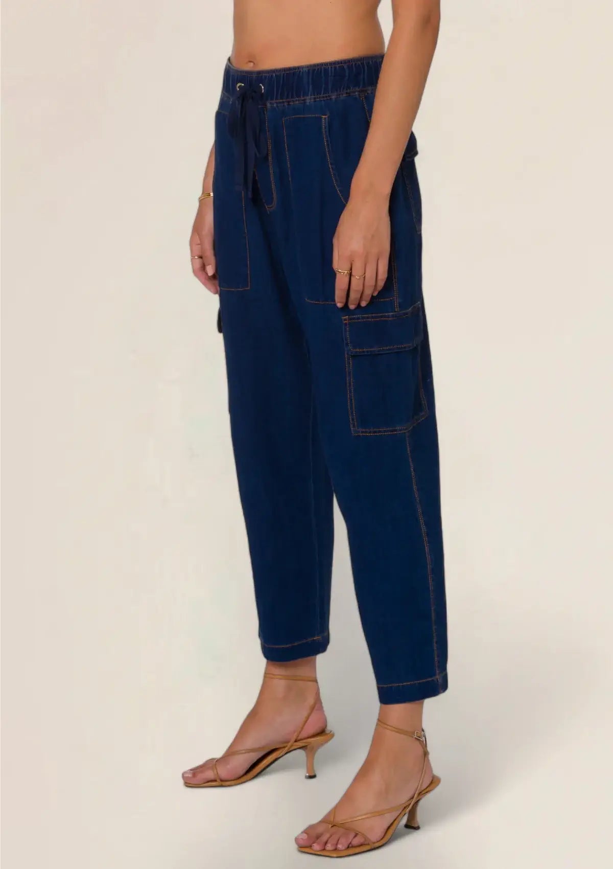 Dark blue with tan stitching, cargo pockets. From Velvet Heart.