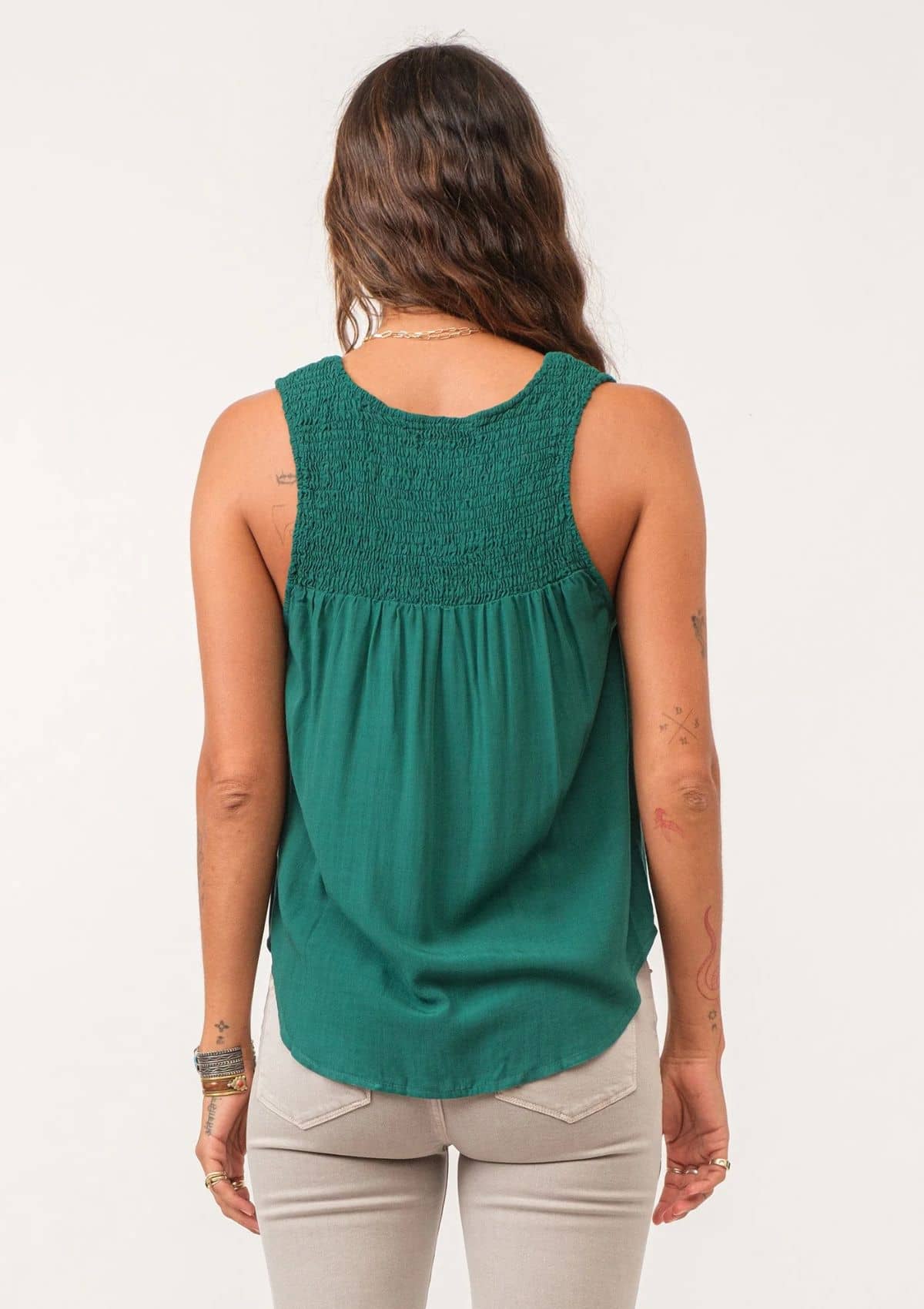Smocked back top. Paired with grey jeans.