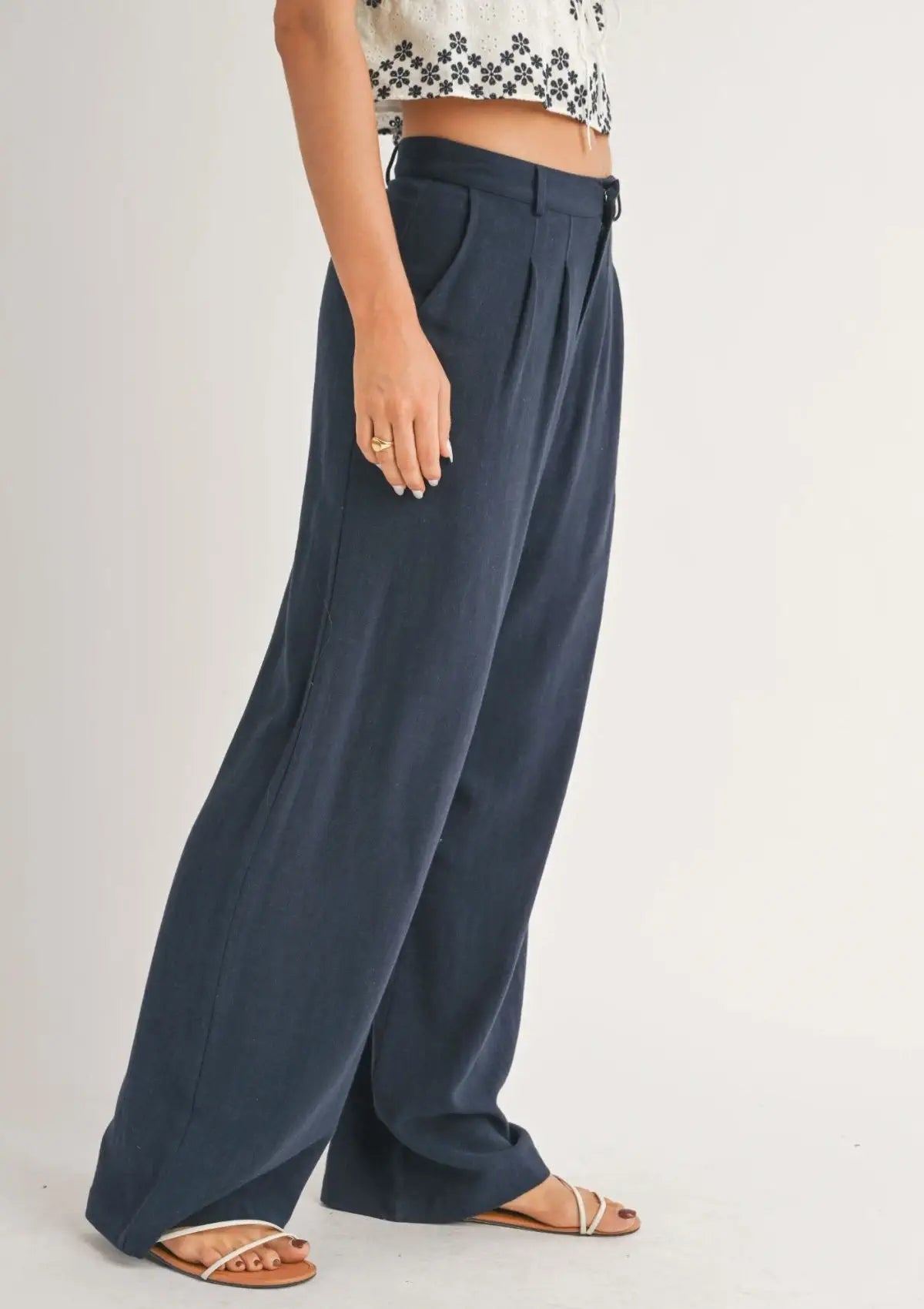 Paired with white sandals and white crop top.