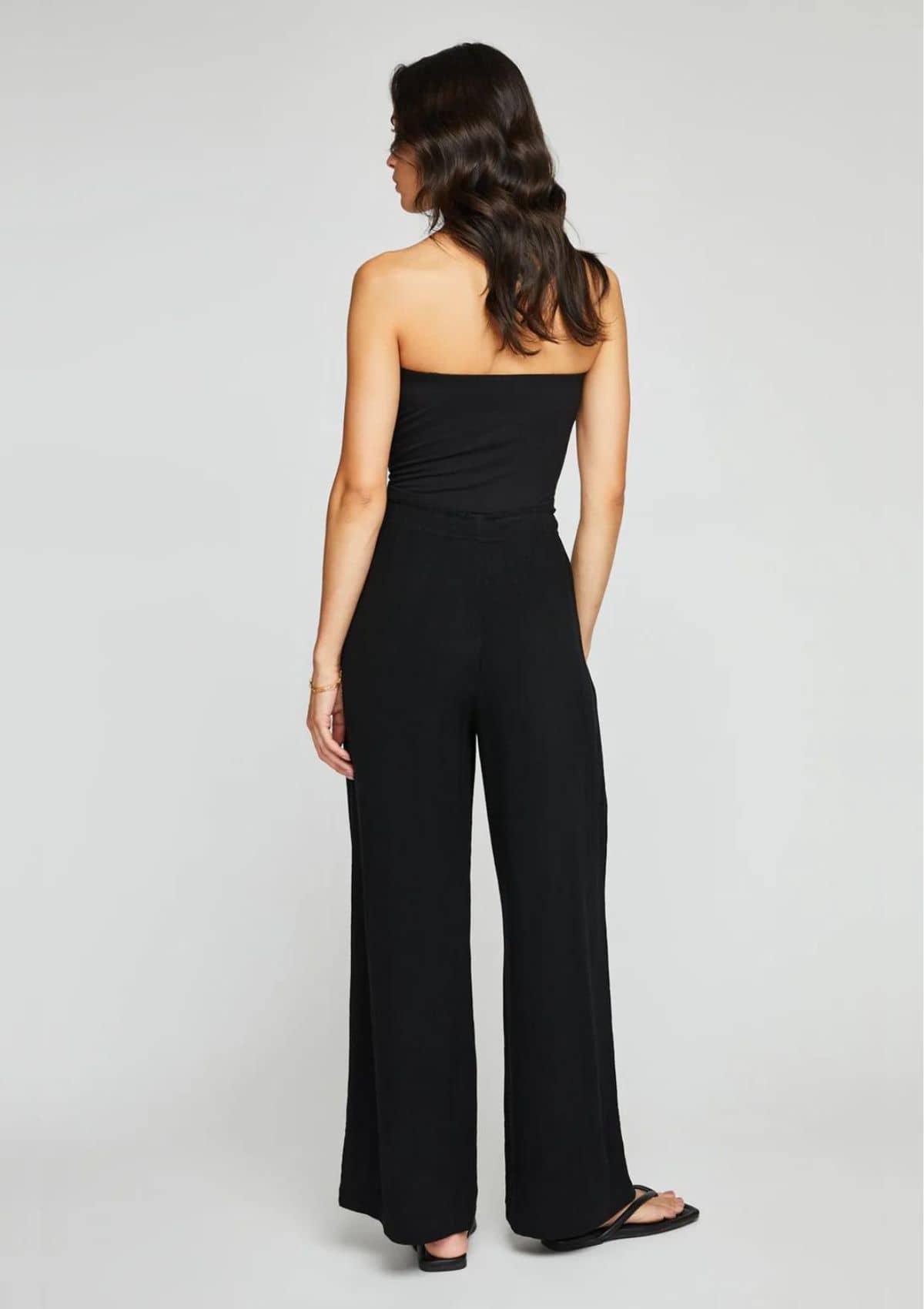 No back pockets. Paired with black tube top.