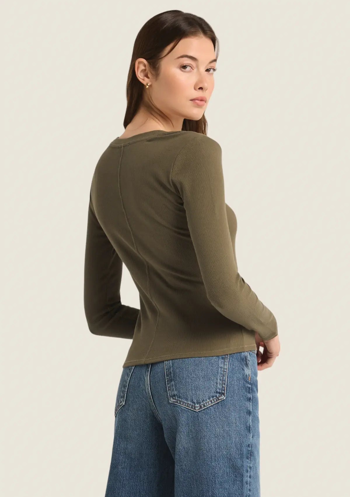 Paired with gold earrings and blue jeans.