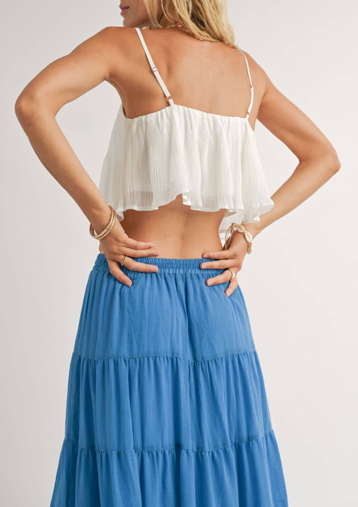 Adjustable spaghetti straps. Paired with blue skirt.