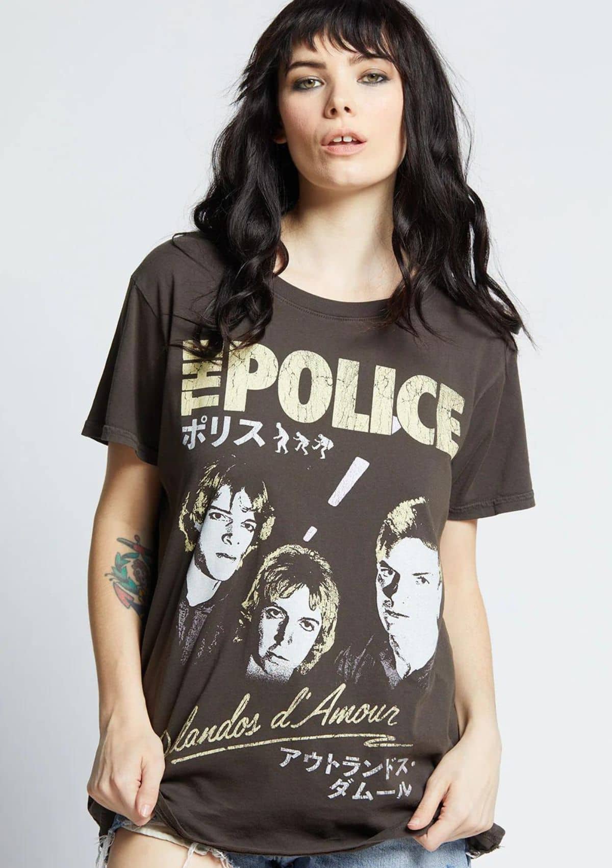 Black with yellow lettering. Paired with blue jean shorts.