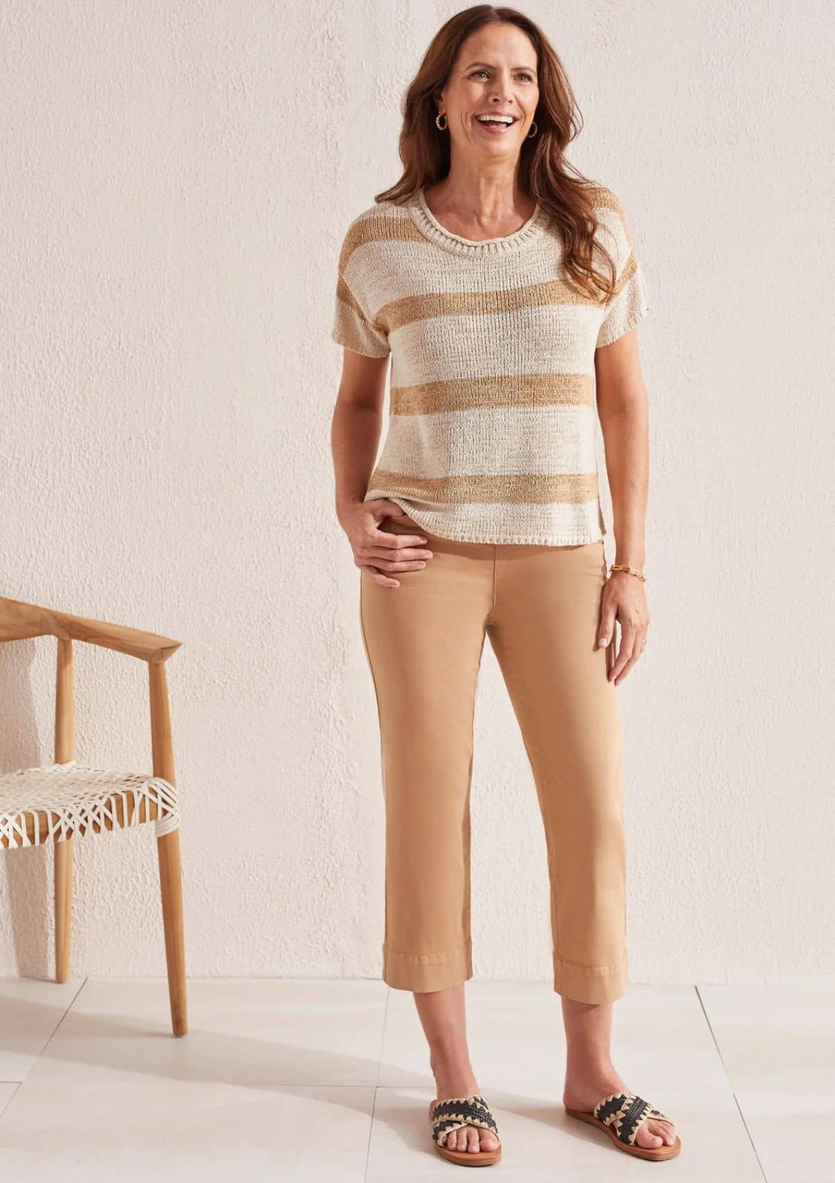 Thick white and thin tan horizontal stripes. Paired with gold jewelry.