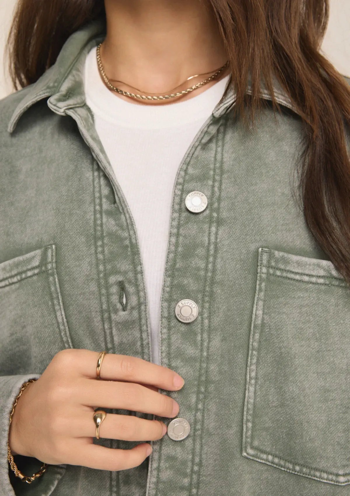 Silver accents. Paired with white tee shirt, blue jeans, gold jewelry.