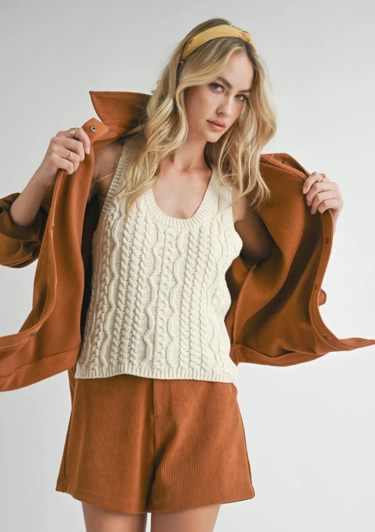 Paired with white tank top sweater knit and brown shorts. From Sadie & Sage.