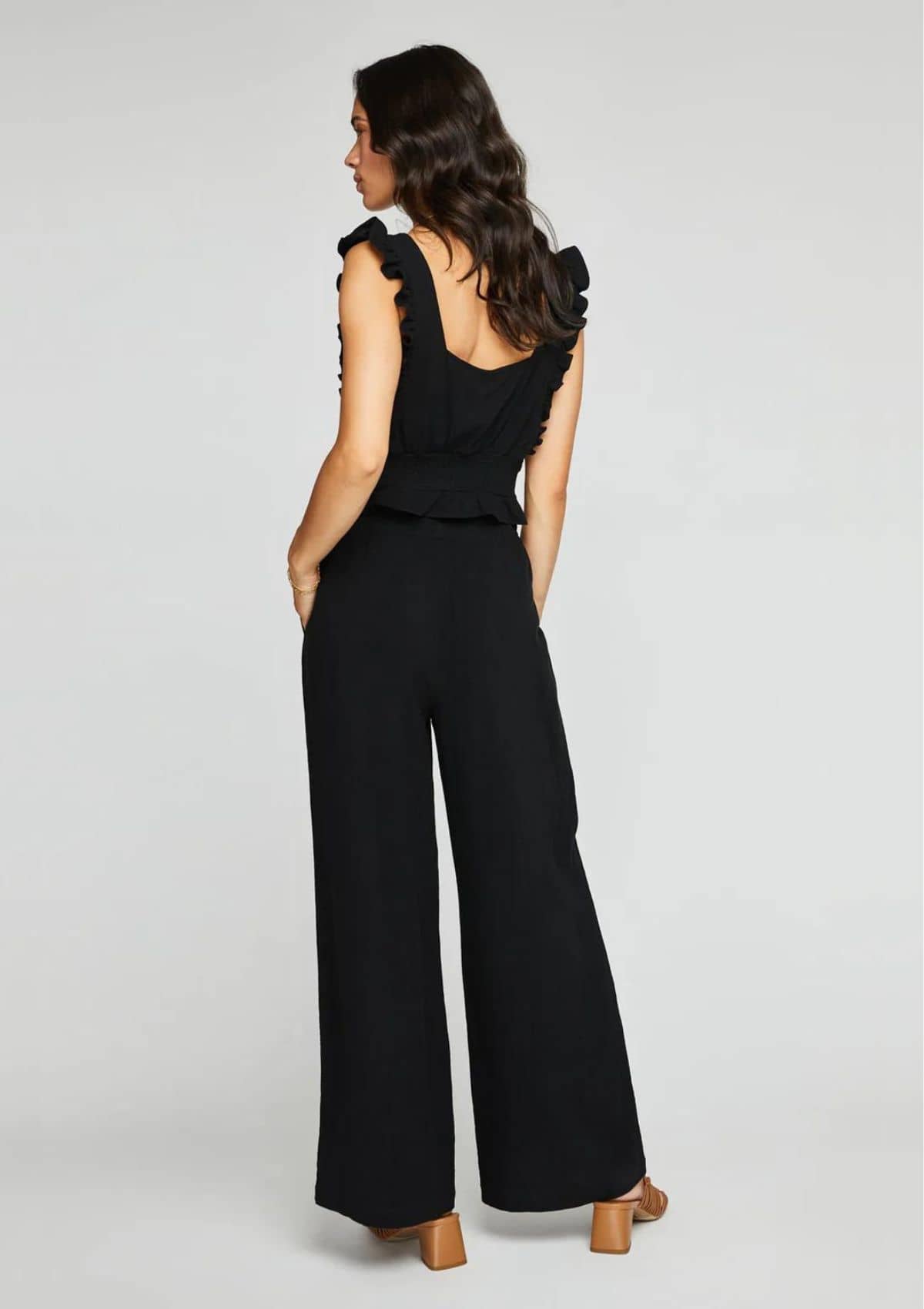 Square back. Paired with black slacks and brown high heels.