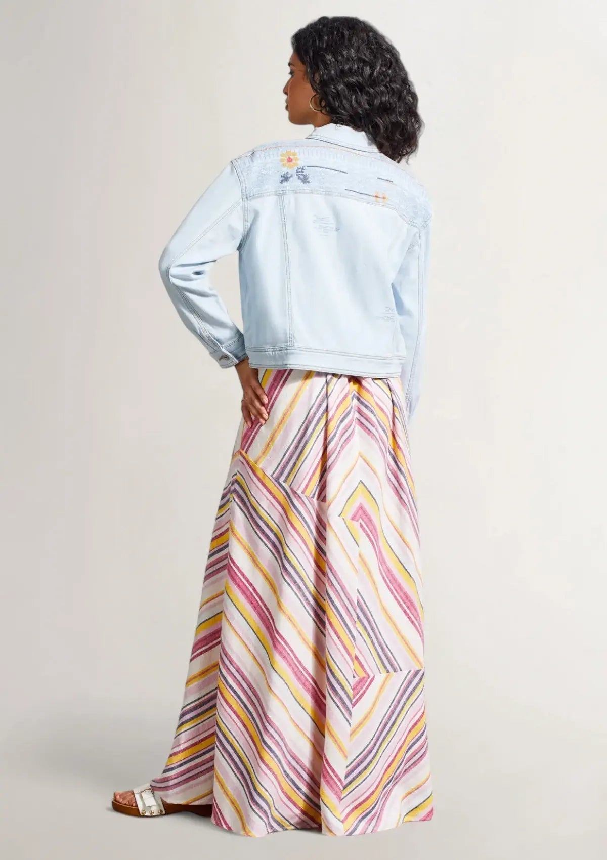 Paired with long pink striped skirt and white sandals. Clothes from Tribal.