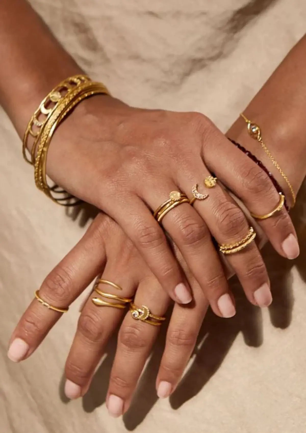 Paired with other gold rings. From Satya Jewelry.