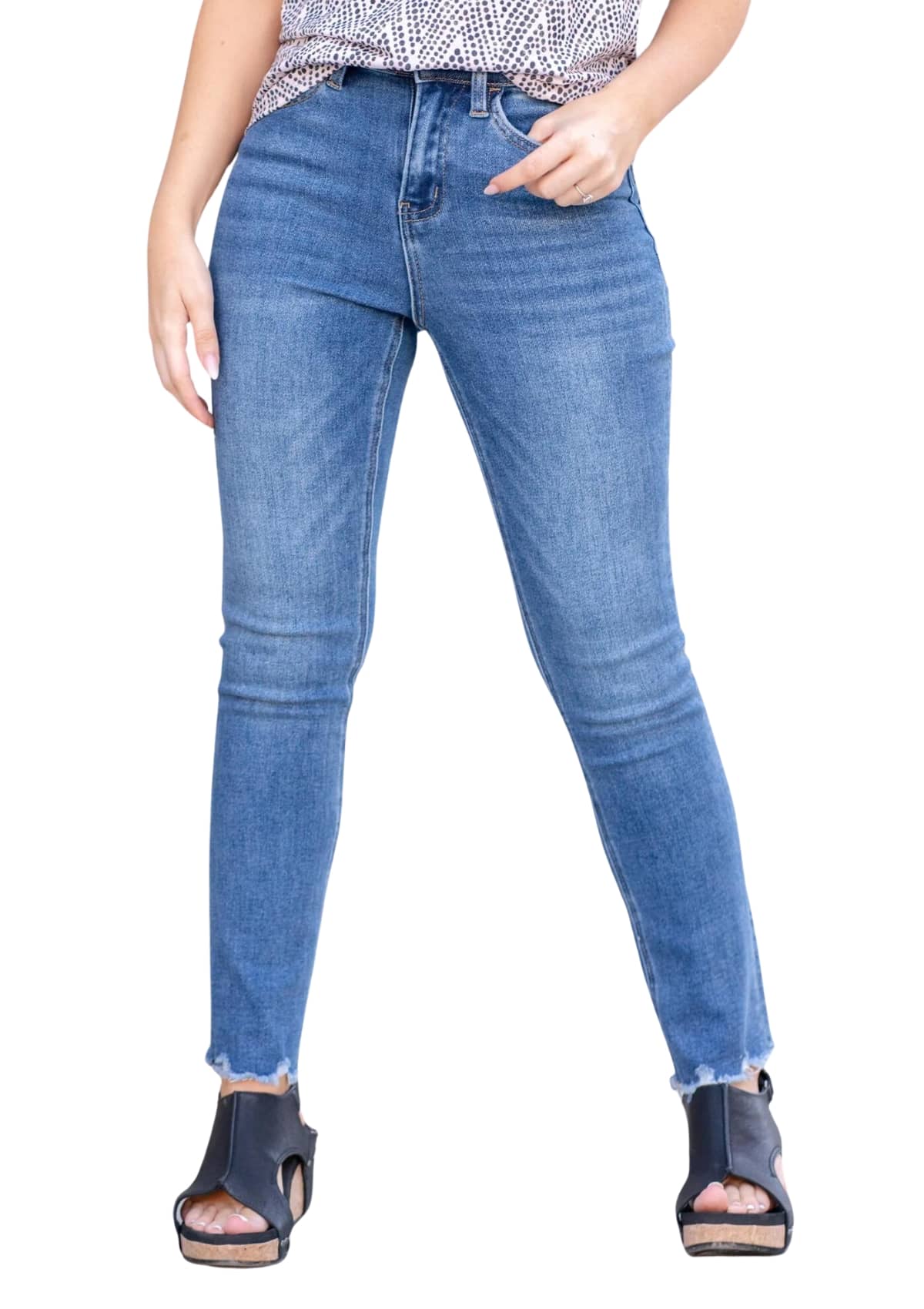 Straight leg blue jeans with frayed hems.