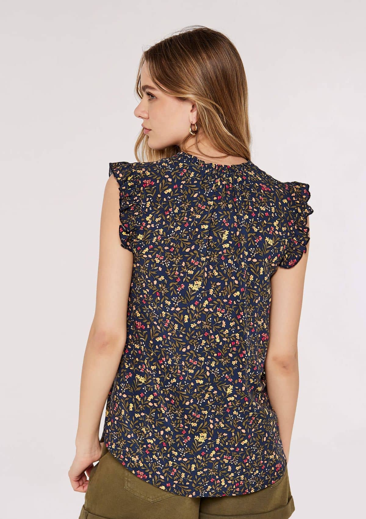 Ruffle short sleeves and neckline hem. Yellow pink floral print.