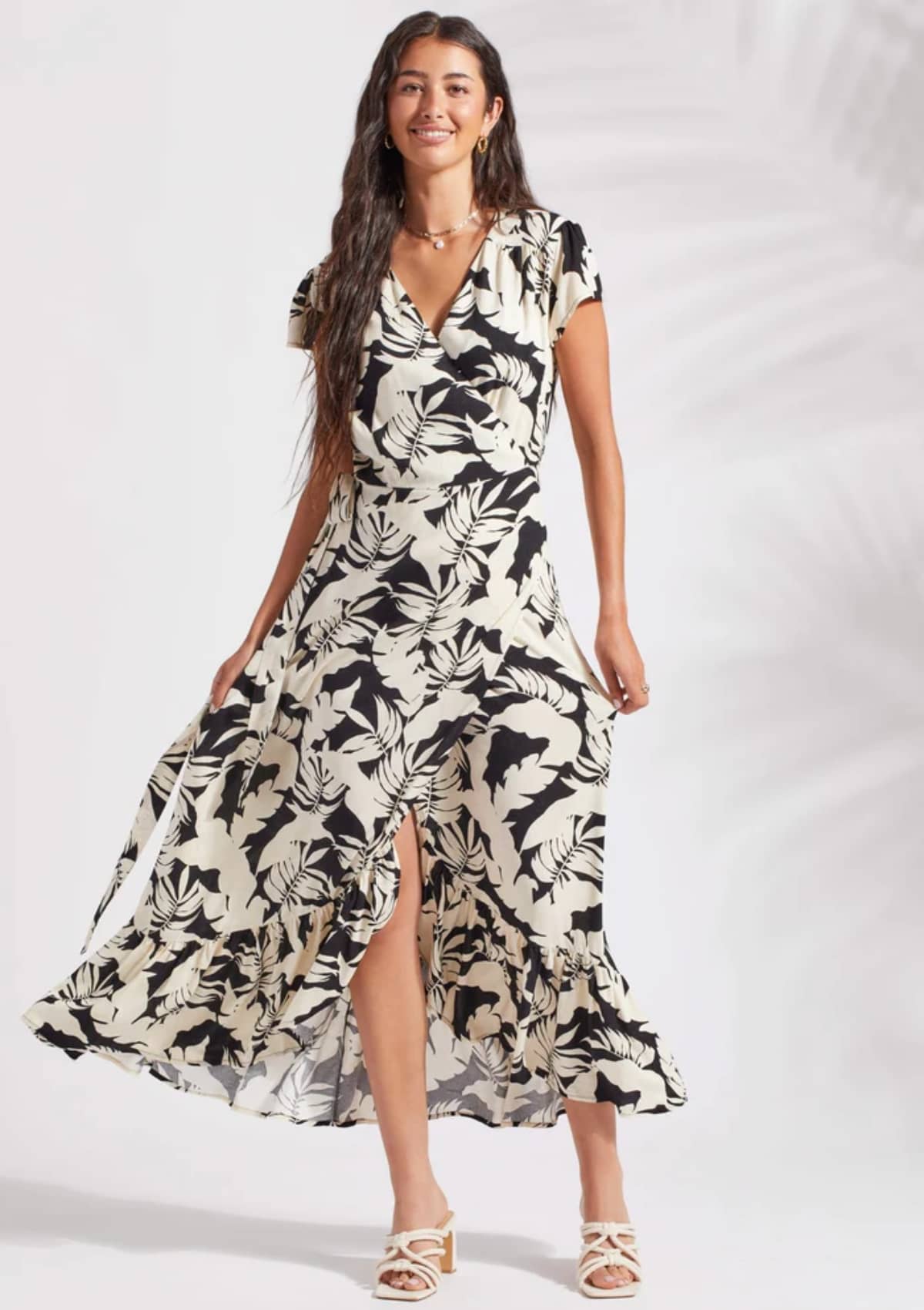 Surplice v-neck black and white floral print dress with slit.