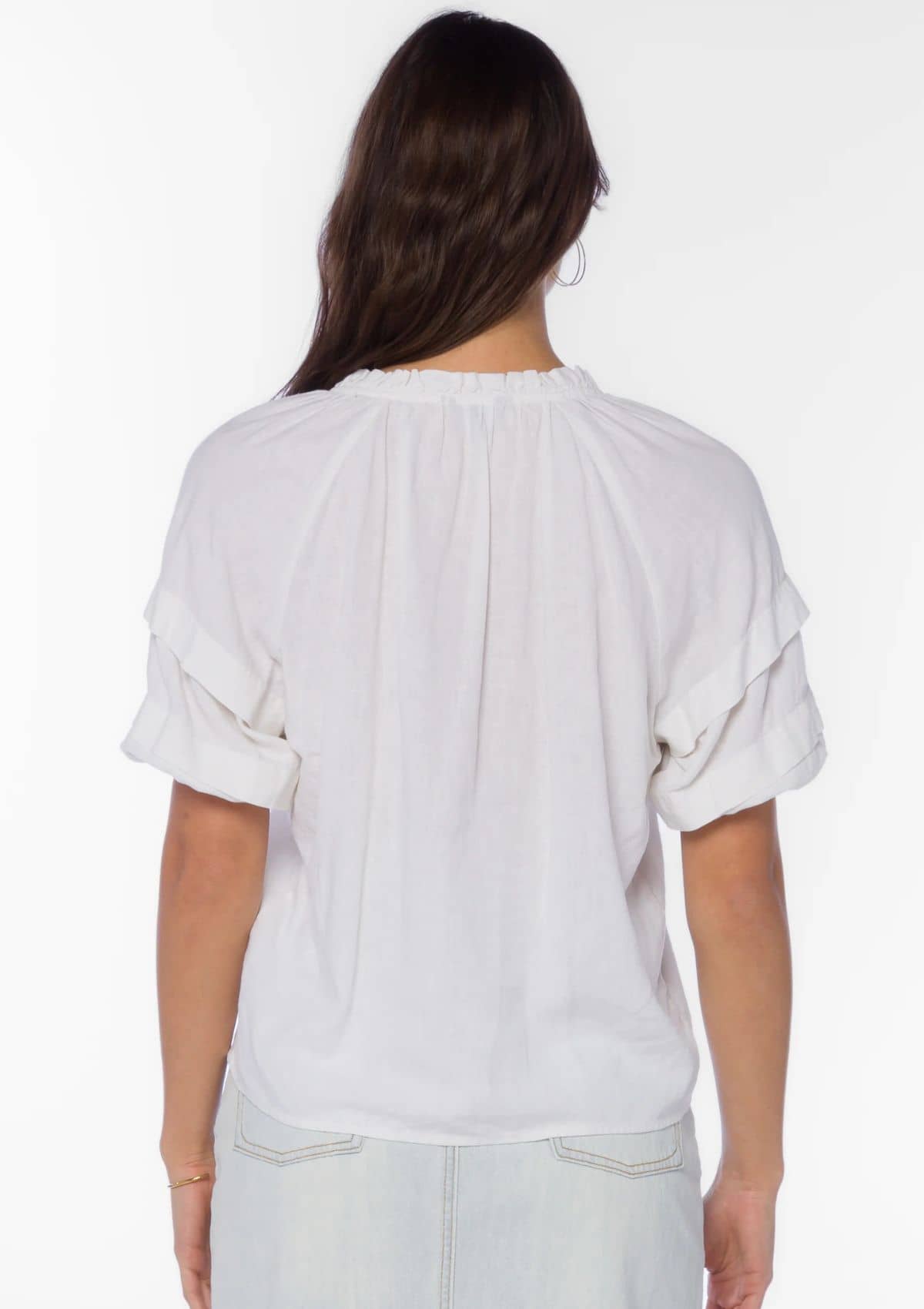 Drawstring collar. Tier sleeves. Ruffle hems.