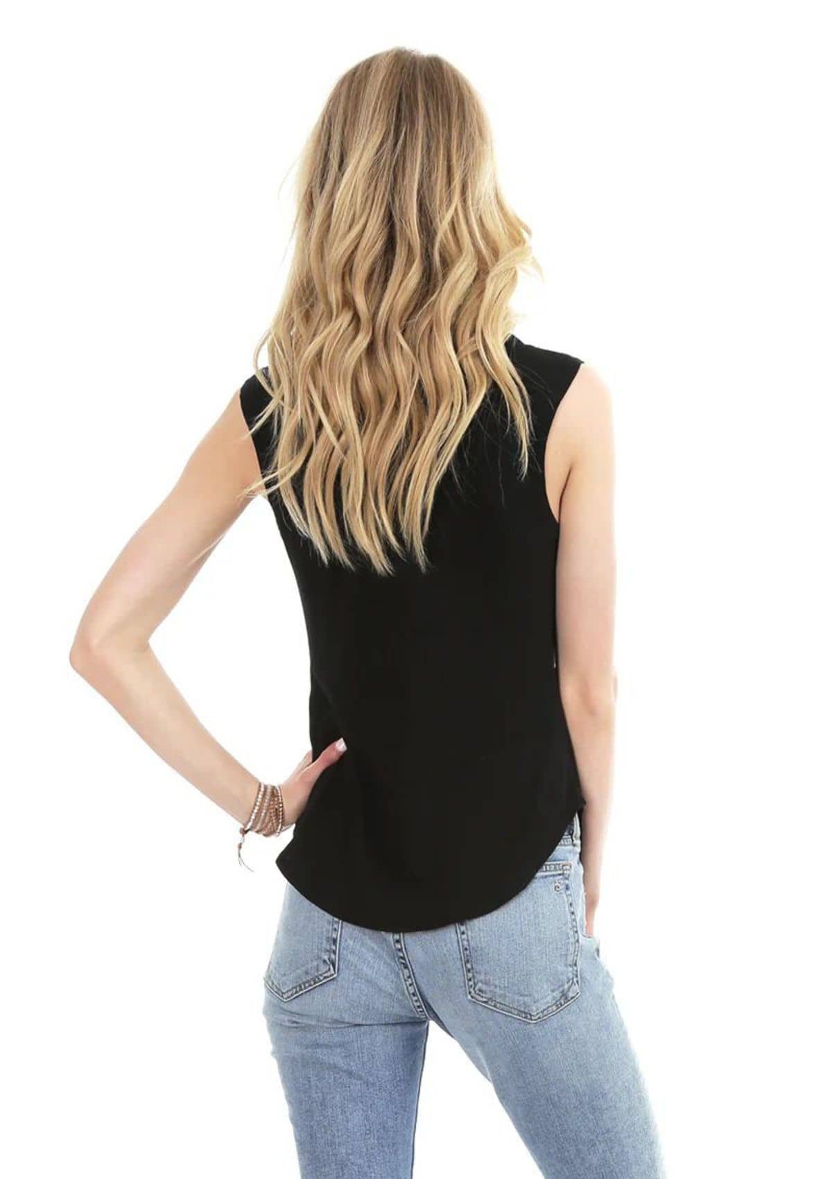 Black sleeveless. Paired with blue jeans.