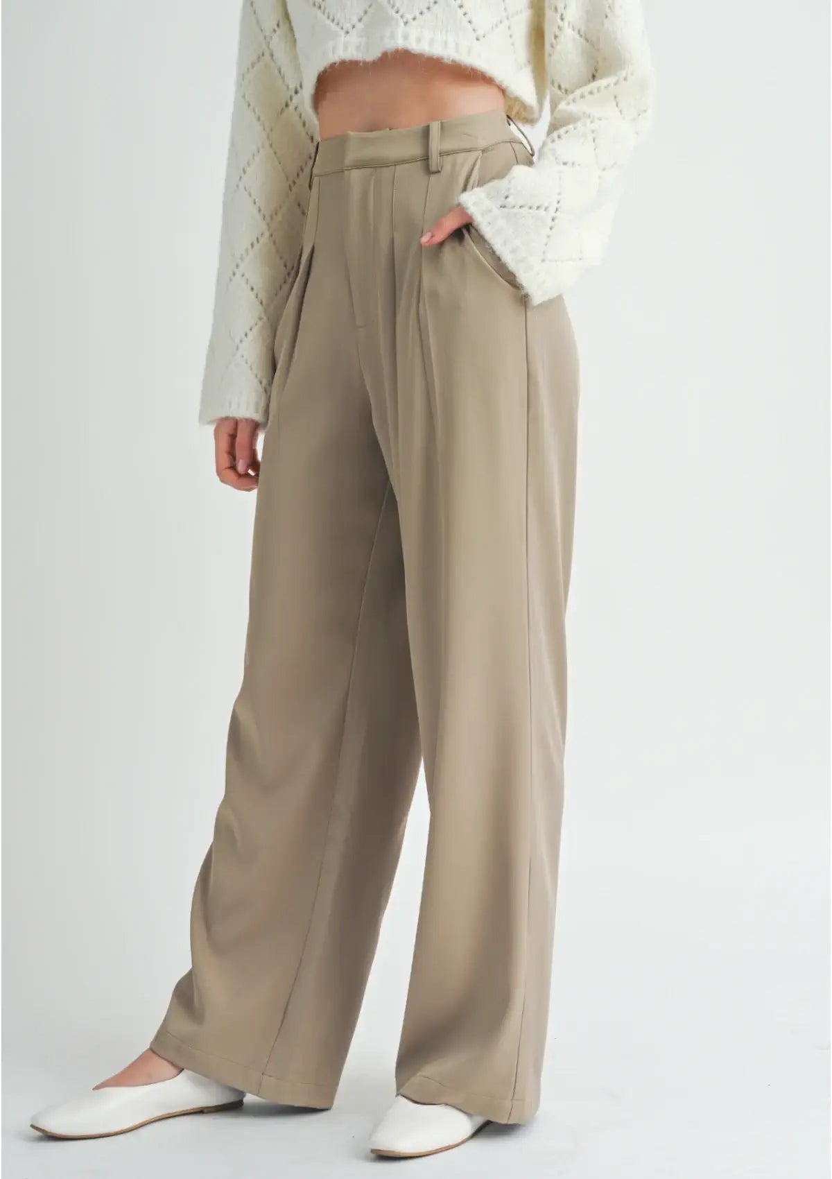 Slash pockets. Paired with white flat shoes, from Sage The Label.