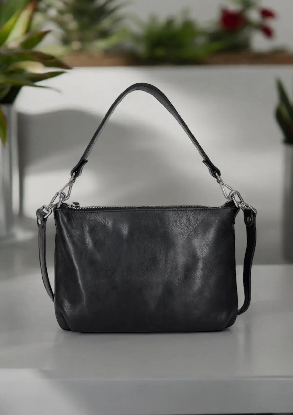 Black leather handbag from Latico leathers.