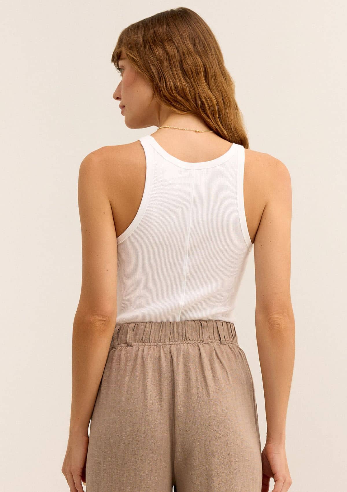 Middle seam on back. Tucked in high rise tan slacks.