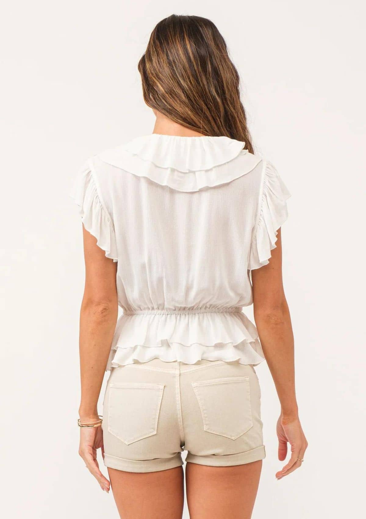 Ruffle sleeves and hems. Cinched waist.